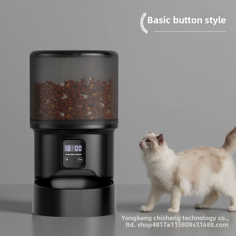 Black pet food dispenser with a cat next to it on a gray background