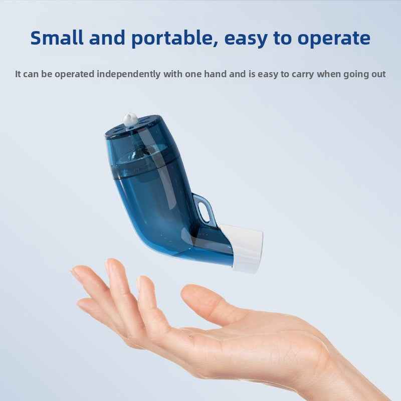 Hand holding compact breathing exercise device showing portable size